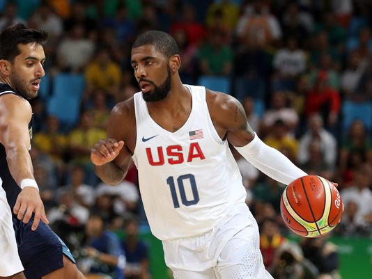 Kyrie Irving of the United States drives past Facundo Campazzo of Argentina during their quarterfinal game at the Olympics/Photo: Jason Getz/USA Today Sports