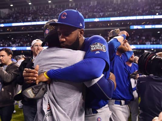 Jason Heyward hugs a teammate after winning the 2016 World Series-Chicago Tribunes