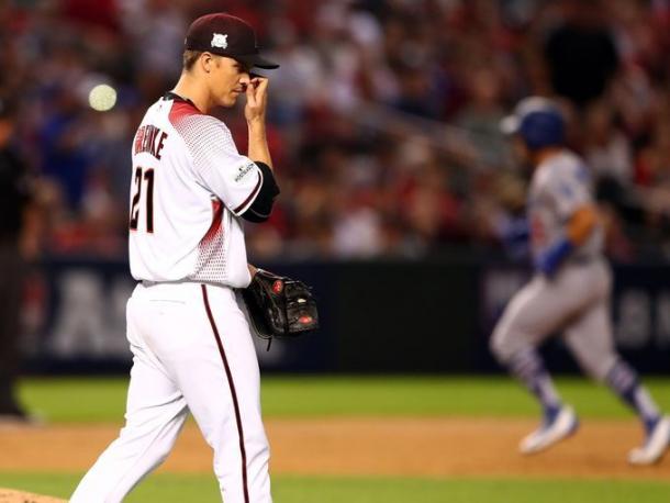 Diamondbacks starting pitcher Zack Greinke (21) reacts after giving up a solo home run to Dodgers catcher Austin Barnes (15) in the sixth inning. | Source – Mark Rebilas/USA TODAY Sports|