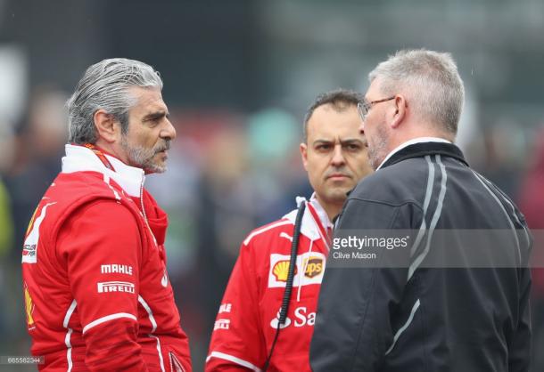 Maurizio Arrivabene (L) chats with Ross Brawn (R). | Photo: Getty Images/Clive Mason