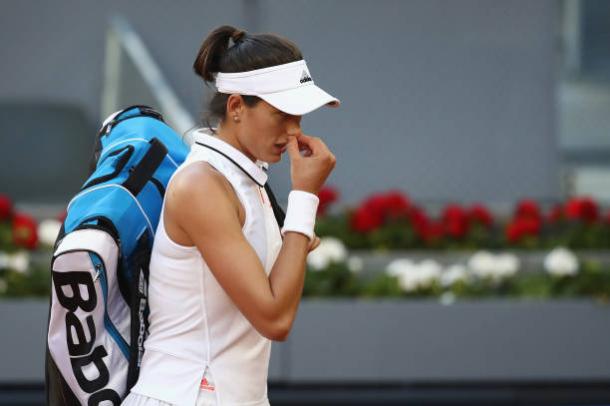 Muguruza walks off court following her loss to Timea Bacsinszky in Madrid (Getty/Julian Finney)