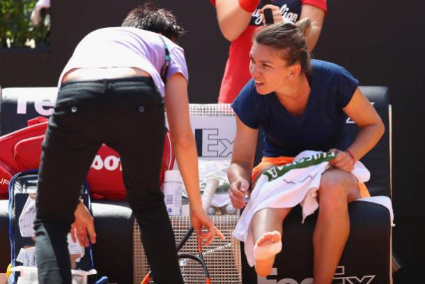 Simona Halep receives treatment on her right ankle during the Rome final, which she lost to Elina Svitolina (Getty/Michael Steele)