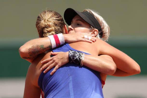 Mattek-Sands hugs Kvitova after the conclusion of their match at the French Open. Photo credit: Ian MacNicol/Getty Images.