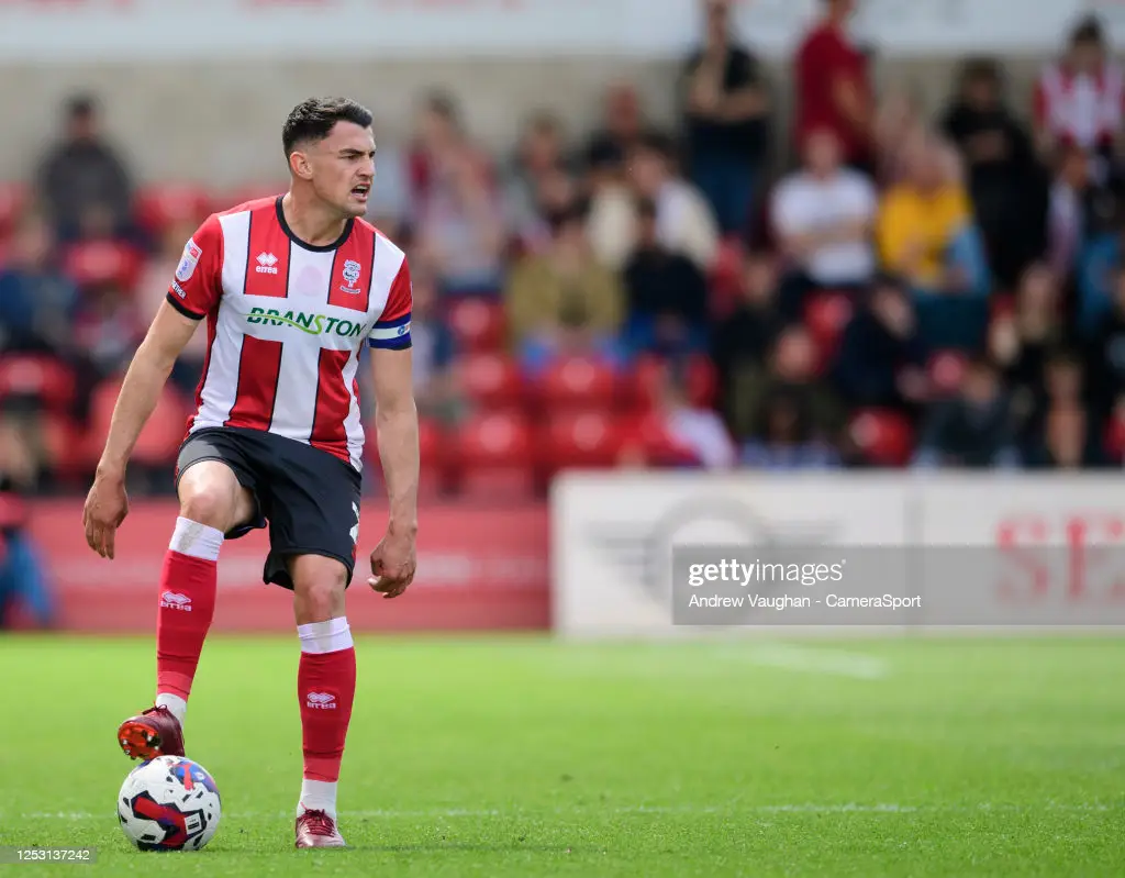 Regan Poole in action for <strong><a  data-cke-saved-href='https://www.vavel.com/en/football/2023/06/22/1149718-carabao-cup-round-one-draw-wrexham-host-former-fa-cup-winners.html' href='https://www.vavel.com/en/football/2023/06/22/1149718-carabao-cup-round-one-draw-wrexham-host-former-fa-cup-winners.html'>Lincoln City</a></strong> last season (Photo by Andrew  Vaughan - CameraSport via <strong><a  data-cke-saved-href='https://www.vavel.com/en/football/2023/08/31/1154770-a-month-to-forget-reflecting-on-the-first-month-of-oldhams-national-league-campaign.html' href='https://www.vavel.com/en/football/2023/08/31/1154770-a-month-to-forget-reflecting-on-the-first-month-of-oldhams-national-league-campaign.html'>Getty Images</a></strong>)