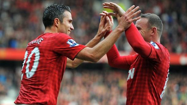 Van Persie and Rooney celebrate a goal for Manchester United (Source: Andrew Yates / AFP)