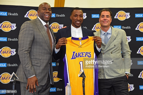 Magic Johnson & Mitch Kupchak with free-agency pick up Kentavious Caldwell-Pope. Photo; Andrew D. Bernstein