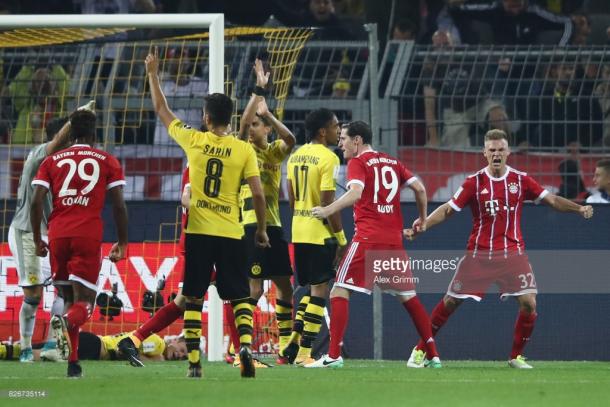 Kimmich (right) celebrates his key role in the late equaliser. | Photo: Getty/Alex Grimm/Bongarts.