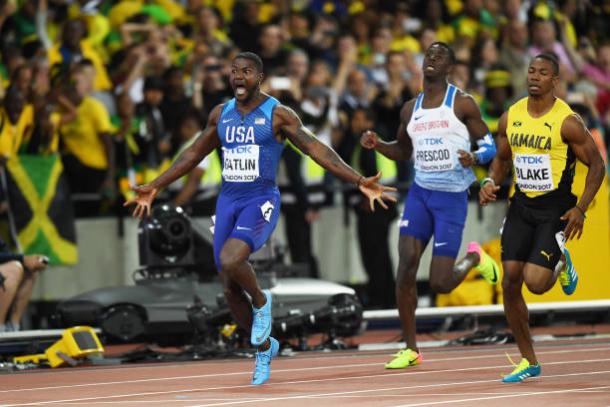 Gatlin celebrates crossing the line to take the world title (Getty/Shaun Botterill)