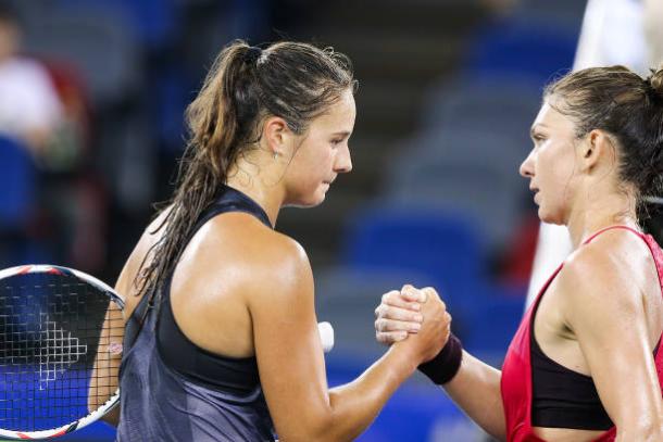 Kasatkina and Halep meet at the net after the one-sided encounter (Getty/Yifan Ding)