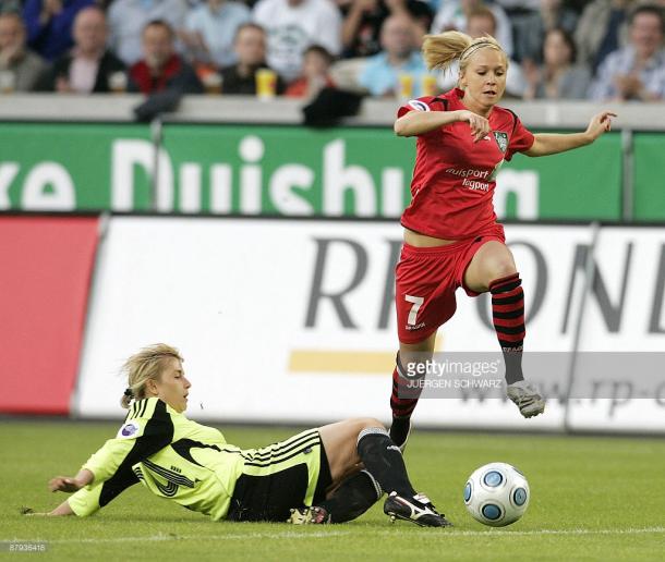 FCR 2001 Duisburg's Turid Knaak (R) and Zvezda-2005's Alla Lyshafay vies for the ball during the UEFA Women's Cup in the western German city of Duisburg on May 22, 2009. The second-leg match ended in a 1-1 after Duisburg won the first-leg 6-0.AFP PHOTO DDP / JUERGEN SCHWARZ GERMANY OUT (Photo credit should read JUERGEN SCHWARZ/AFP/Getty Images)