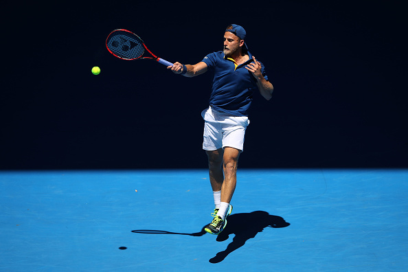 Denis Kudla hits a forehand as he takes the opening set (Photo: Mark Kolbe/Getty Images)