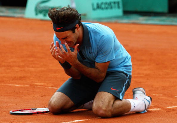 An extremely emotional yet overjoyed Federer falls to the ground as he wins the French Open in 2009. Credit: Ryan Pierse/Getty Images