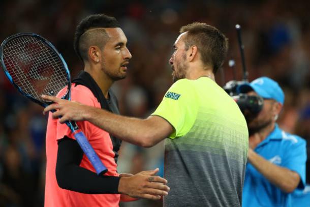 Kyrgios and Troicki meet following the end of their match (Getty/Clive Brunskill)