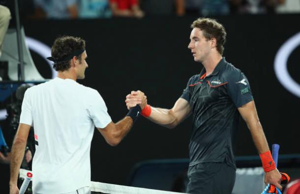 Federer and Struff meet at the net after the encounter (Getty/Clive Brunskill)