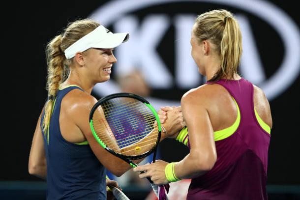 Wozniacki and Bertens meet at the net after a competitive third round clash (Getty/Cameron Spencer)