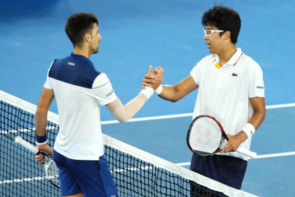 Djokovic and Chung meet at the net following the conclusion of the match (Getty/Mark Kolbe)