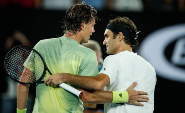 Berdych and Federer meet following the conclusion of the match (Getty/XIN LI)