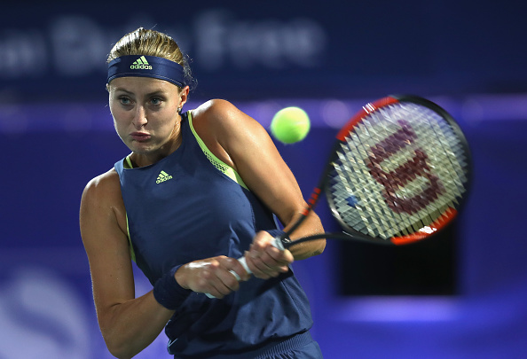 Mladenovic breaks to close out the first set | Photo: Karim Saib/Getty Images