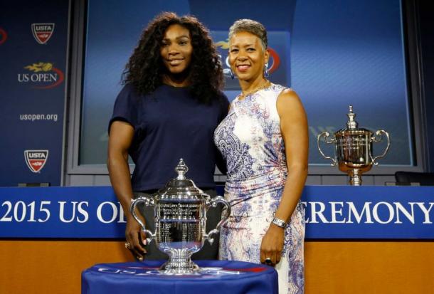 Adams poses with Serena at the 2015 U.S. Open draw ceremony. Credit: Kathy Willens, STF / Associated Press