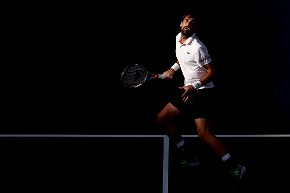 Jeremy Chardy ready to play an overhead shot (Photo: Matthew Stockman/Getty Images)