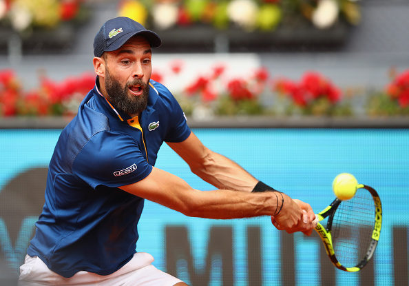 Benoit Paire reaches for a backhand shot (Photo: Clive Brunskill/Getty Images)