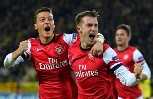 Ramsey and Ozil celebrate in Dortmund. Source: givemesport.com