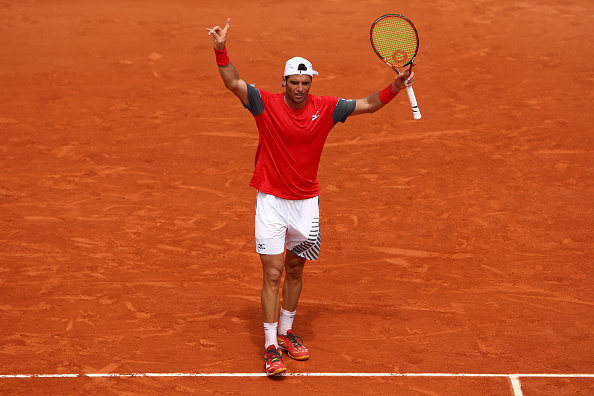 Malek Jaziri celebrates winning the second set (Photo: Cameron Spencer/Getty Images)