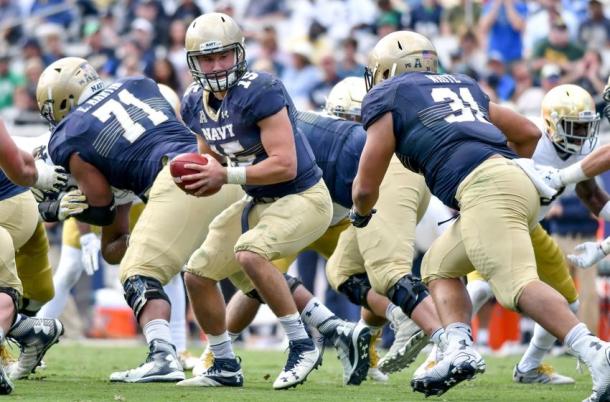 Navy quarterback Will Worth hands the ball off against the Notre Dame fighting Irish at EverBank Field in Jacksonville/Getty Images