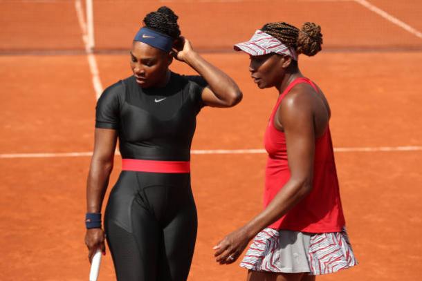 Serena and Venus Williams in action yesterday (Getty/Matthew Stockman)