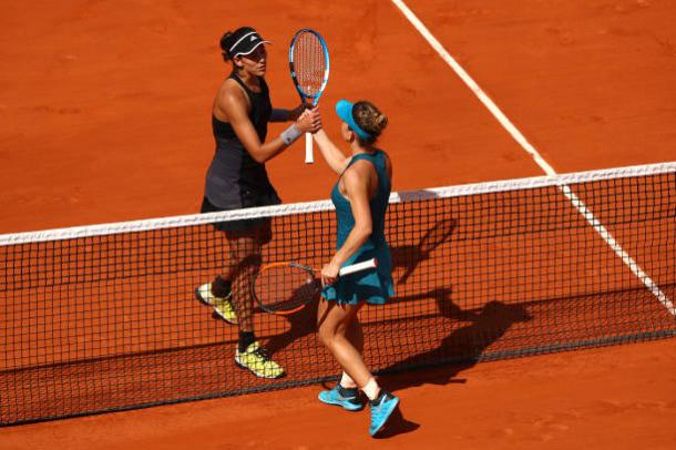 Muguruza and Halep meet following the conclusion of their semifinal encounter (Getty/Cameron Spencer)