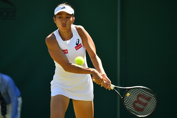 Zhang gets back into the match after taking the second set | Photo: Ben Stansall/Getty Images