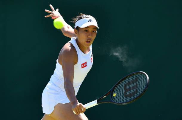 Zhang putting pressure on the German's serve | Photo: Ben Stansall/Getty Images