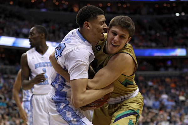 It's always a battle between the Fighting Irish and the Tar Heels, who will face off for the third time this year when things tip off Sunday (Photo: Patrick Smith/Getty Images).