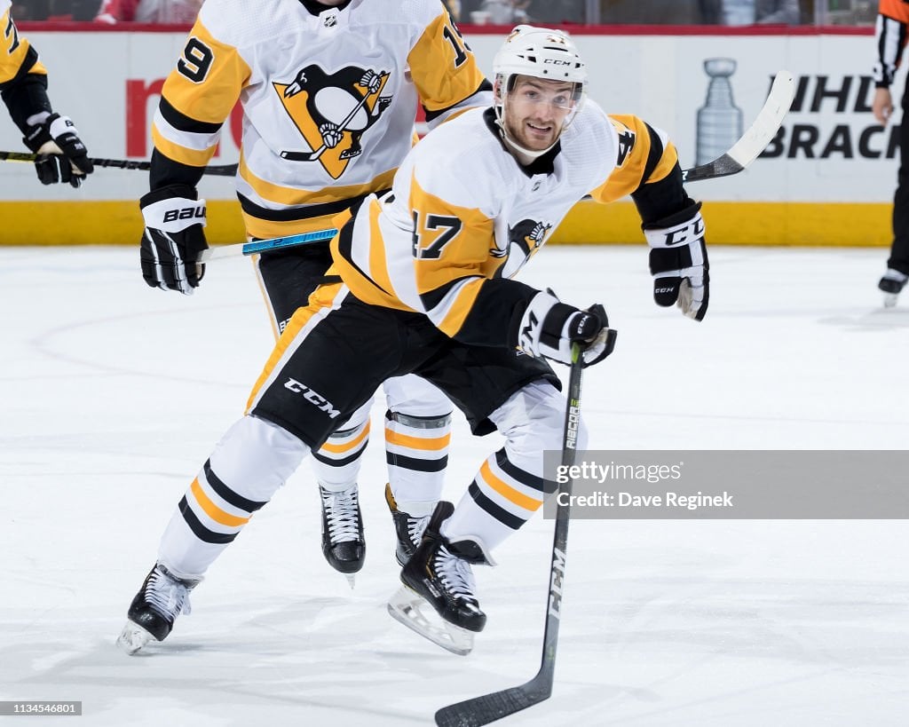 Adam Johnson #47 of the Pittsburgh Penguins keeps an eye on the play during third period action against the Winnipeg Jets at the Bell MTS Place on October 13, 2019 in Winnipeg, Manitoba, Canada. The Pens defeated the Jets 7-2. (Photo by Darcy Finley/NHLI via Getty Images)