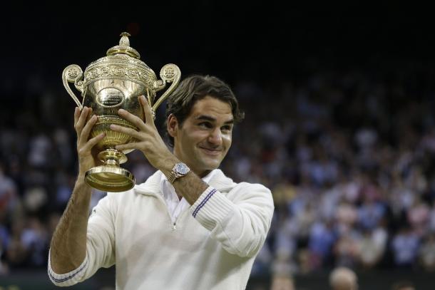 Federer holds up the Gentlemen's singles trophy for the seventh time in 2012. Credit: Associated Press