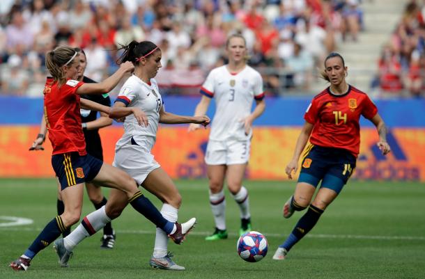 Alex Morgan (13) took a lot of knocks in this physical match as Spain consistently put a body on her. | Photo: AP Photo - Alessandra Tarantino