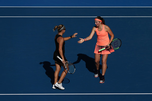 Kirsten Flipkens and Jelena Ostapenko during their doubles match | Photo: Anthony Au-Yeung/Getty Images AsiaPac