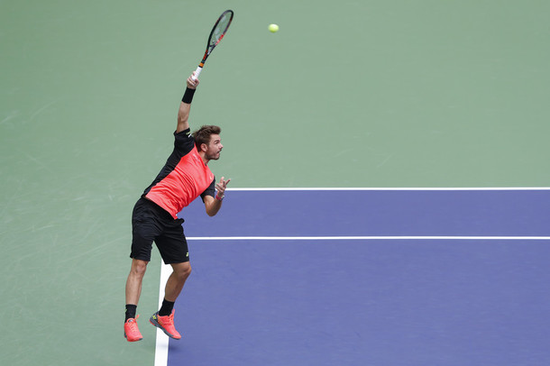Wawrinka serves to Edmund (Photo by Lintao Zhang/Getty Images)