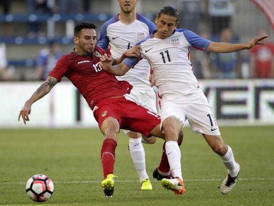 American/Bolivian midfielder Alejandro Melean holding off United States' midfielder Alejandro Bedoya in the 4-0 defeat for La Verde on Saturday at Children's Mercy Park | Colin E. Braley -  AP