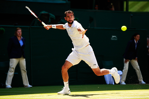 Cilic rips a forehand on the run, hitting the winner down the line. Credit: Adam Pretty/Getty Images