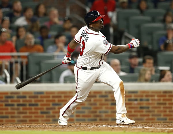 Adonis Garcia hits a sacrifice fly in the sixth inning of the Braves' loss to the Mets/Photo: Mike Zarilli/Getty Images