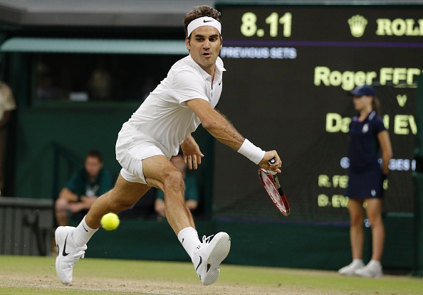 Federer sprints to reach the backhand, hitting it crosscourt for a winner. Credit: Adrian Dennis/Getty Images