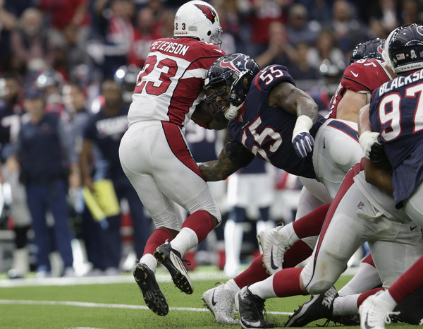 Benardrick McKinney #55 of the Houston Texans hits Adrian Peterson #23 of the Arizona Cardinals behind the line of scrimmage in the fourth quarter. |Source: Tim Warner/Getty Images North America|