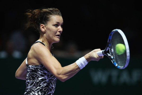 Agnieszka Radwanska hits a forehand during her semifinal match against Angelique Kerber at the 2016 BNP Paribas WTA Finals Singapore presented by SC Global. | Photo: Julian Finney/Getty Images