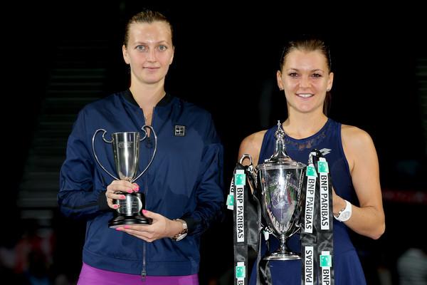 Petra Kvitova of Czech Republic and Agnieszka Radwanska of Poland pose with their trophies after their final match during the BNP Paribas WTA Finals, which Radwanka won in three sets, at Singapore Sports Hub on November 1, 2015 in Singapore. | Photo: Matthew Stockman/Getty Images AsiaPac