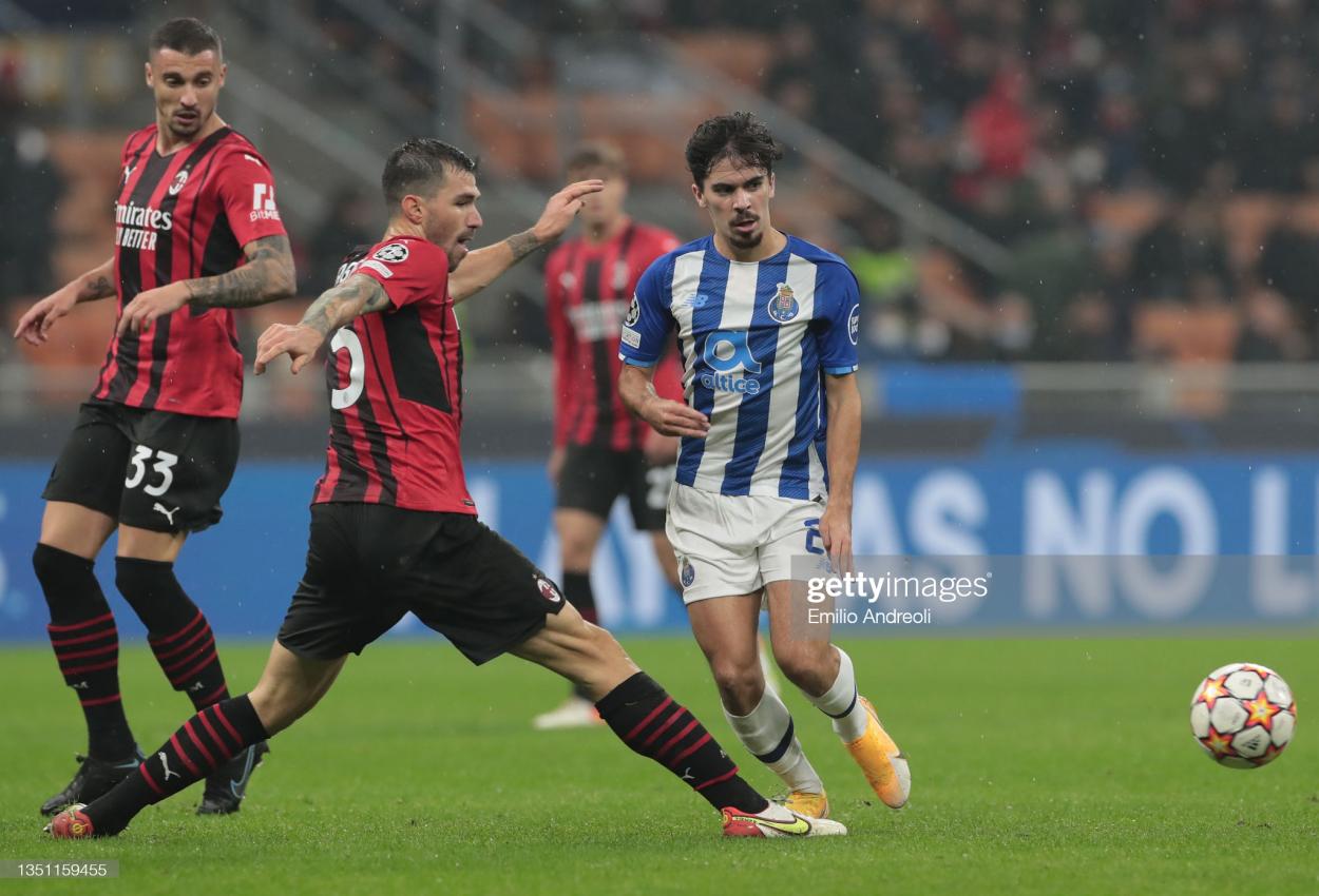 MILAN, ITALY - NOVEMBER 03: Vitinha of FC Porto is challenged by Alessio Romagnoli of AC Milan during the UEFA Champions League group B match between AC Milan and FC Porto at Giuseppe Meazza Stadium on November 03, 2021 in Milan, Italy. (Photo by Emilio Andreoli/Getty Images)