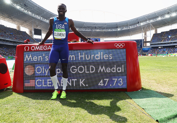 Kerron Clement poses with the time board after winning gold (Getty/Alexander Hassenstein)