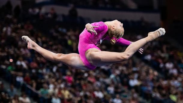 Alyssa Baumann performs on the balance beam at the Secret US Classic in Hartford/Getty Images