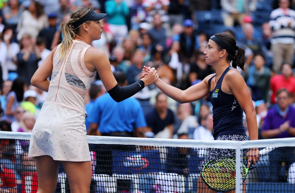 Sharapova and Sevastova meets at the net after their US Open fourth-round match | Photo: Richard Heathcote/Getty Images North America