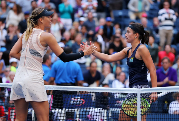 Maria Sharapova and Anastasija Sevastova shake hands after their fourth-round battle at the 2017 U.S. Open. | Photo: Richard Heathcote/Getty Images